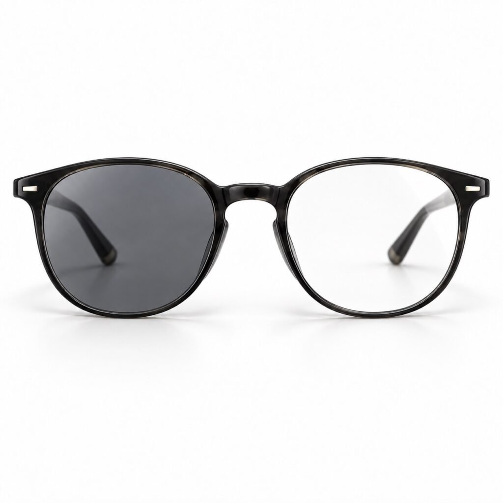 Eyeglasses with one light-adaptive (photochromic) lens darkened and one clear