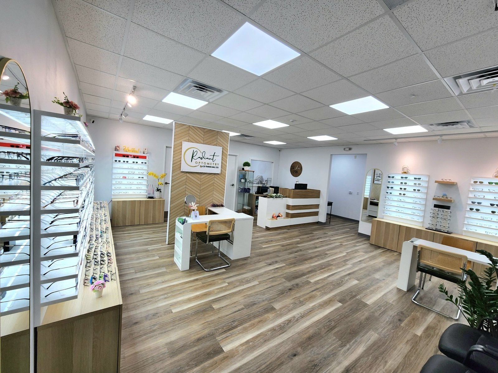 Optical showroom with eyeglass frame displays and fitting tables at Radiant Optometry in Bellflower, CA